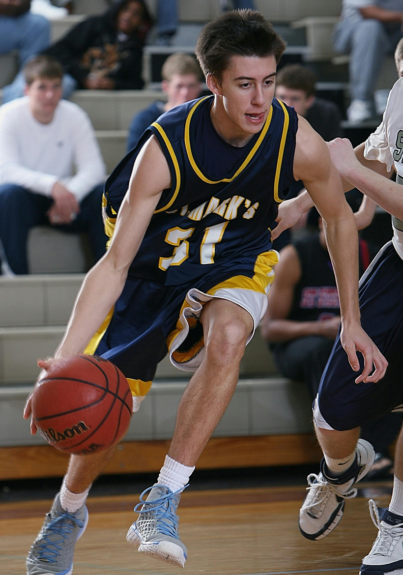 a young boy playing basketball