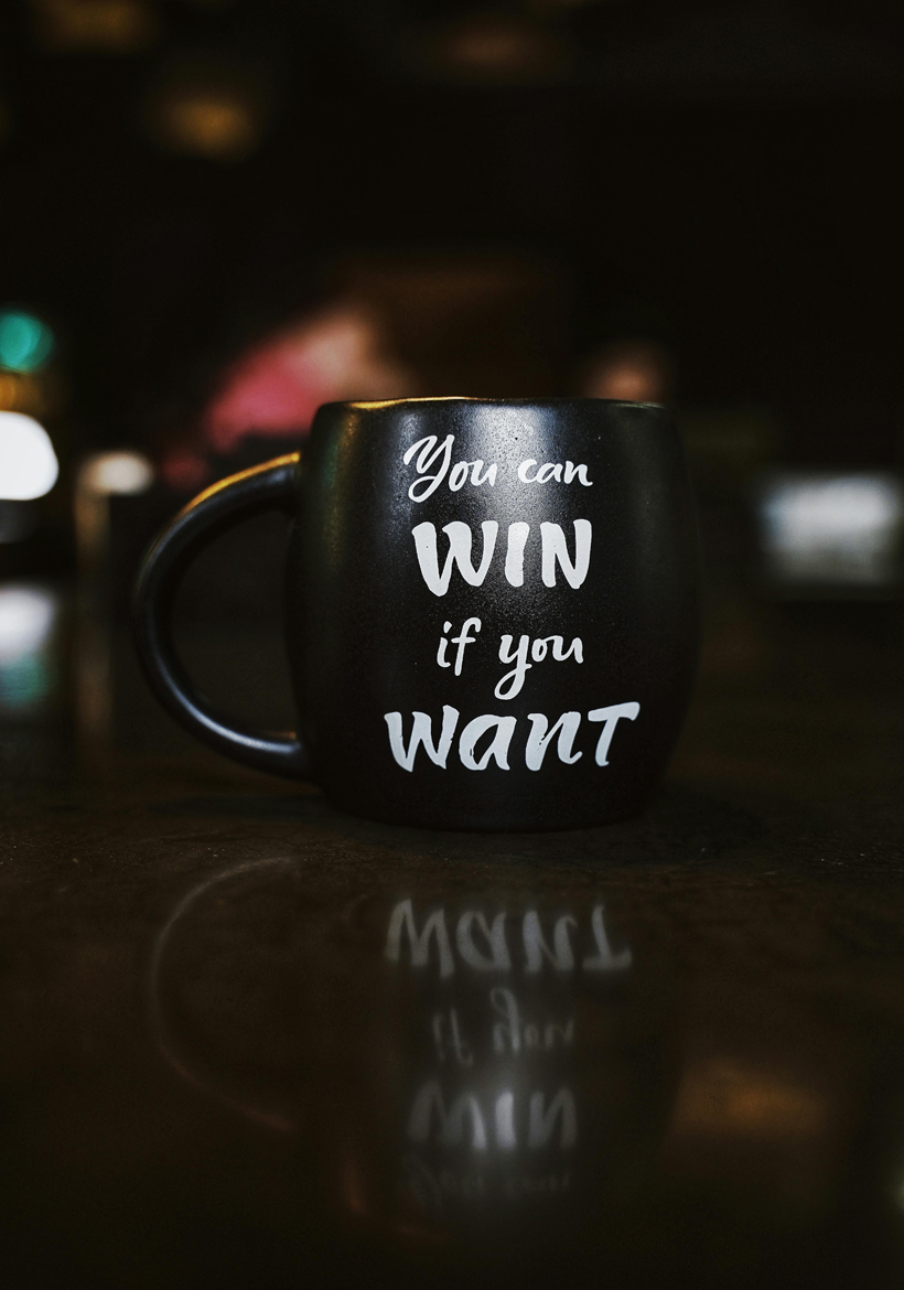 quotation written on black coffee mug