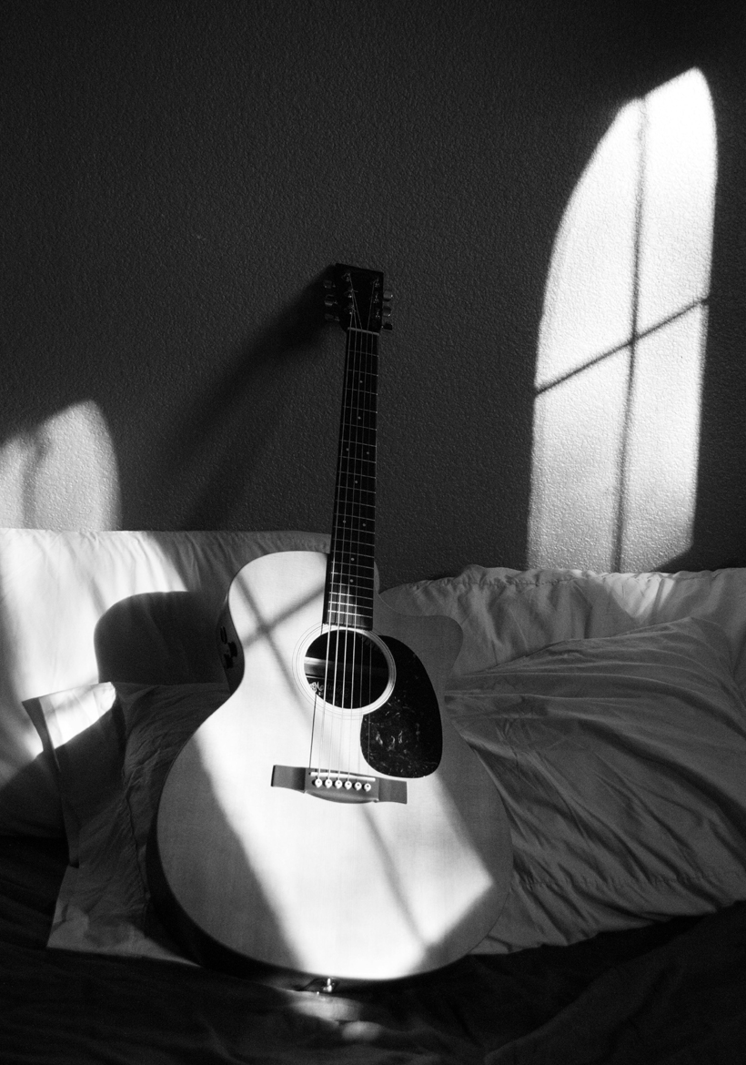 standing guiter with sunny light shadow