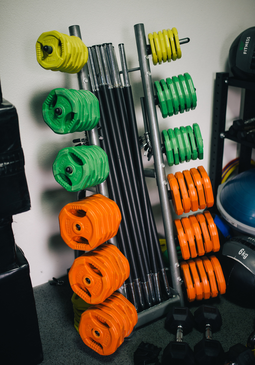 colorful gym weightlift plates with rods