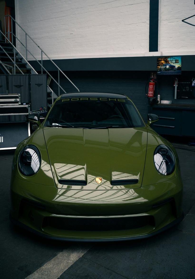dark green porsche sports car