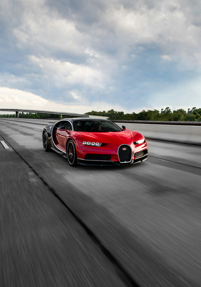 dark red bugatti racing car on road