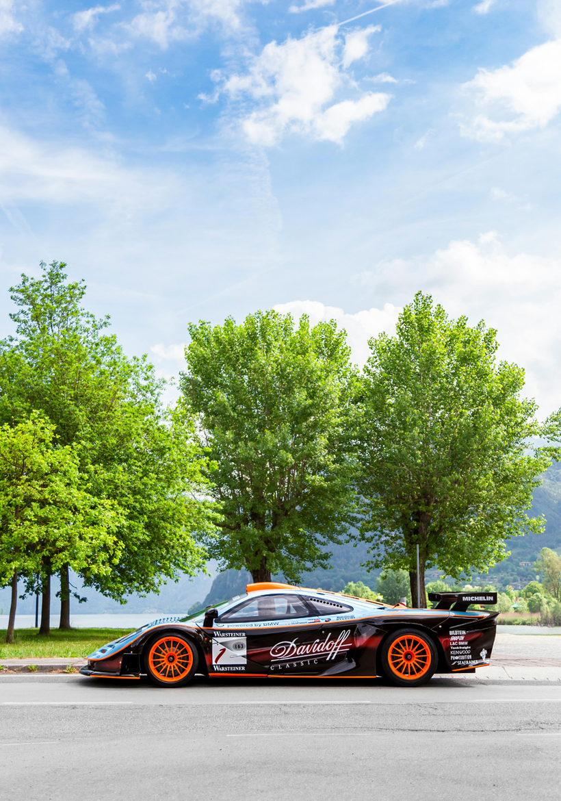 f1 sporty car parked in the street