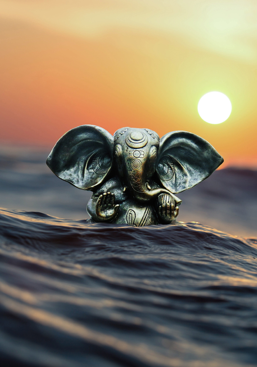 ganpati bappa in wave with beautiful sunset view
