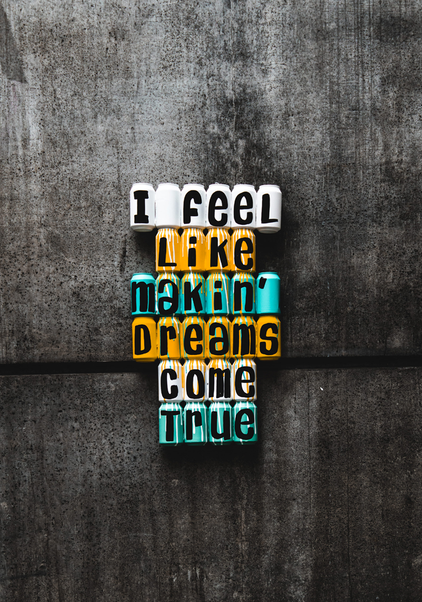 idea quotation written on the colddrinks cans