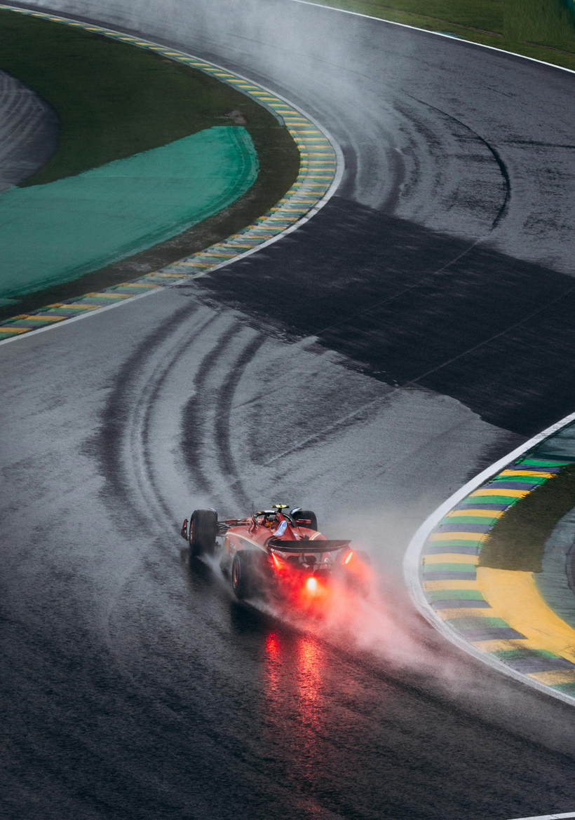 man drive a racing car on the snowing floor