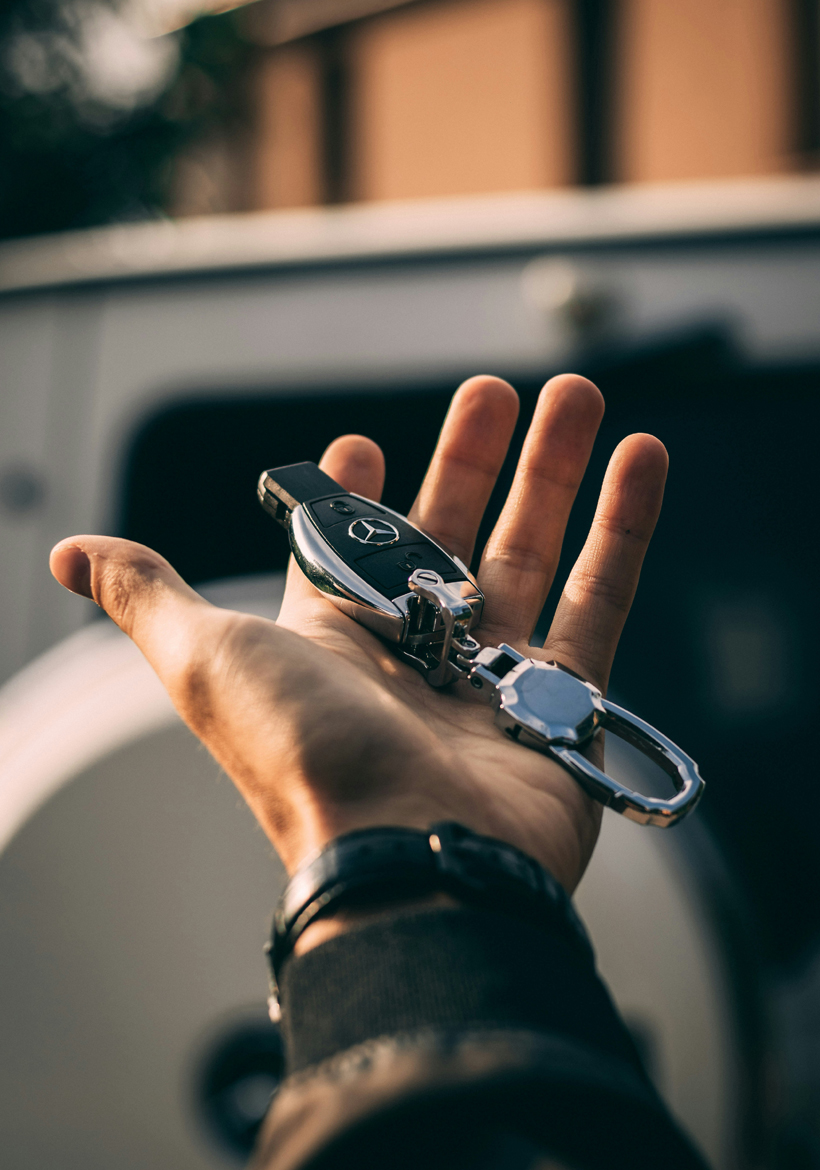 Man Holding A BMW Car Key | Car Poster