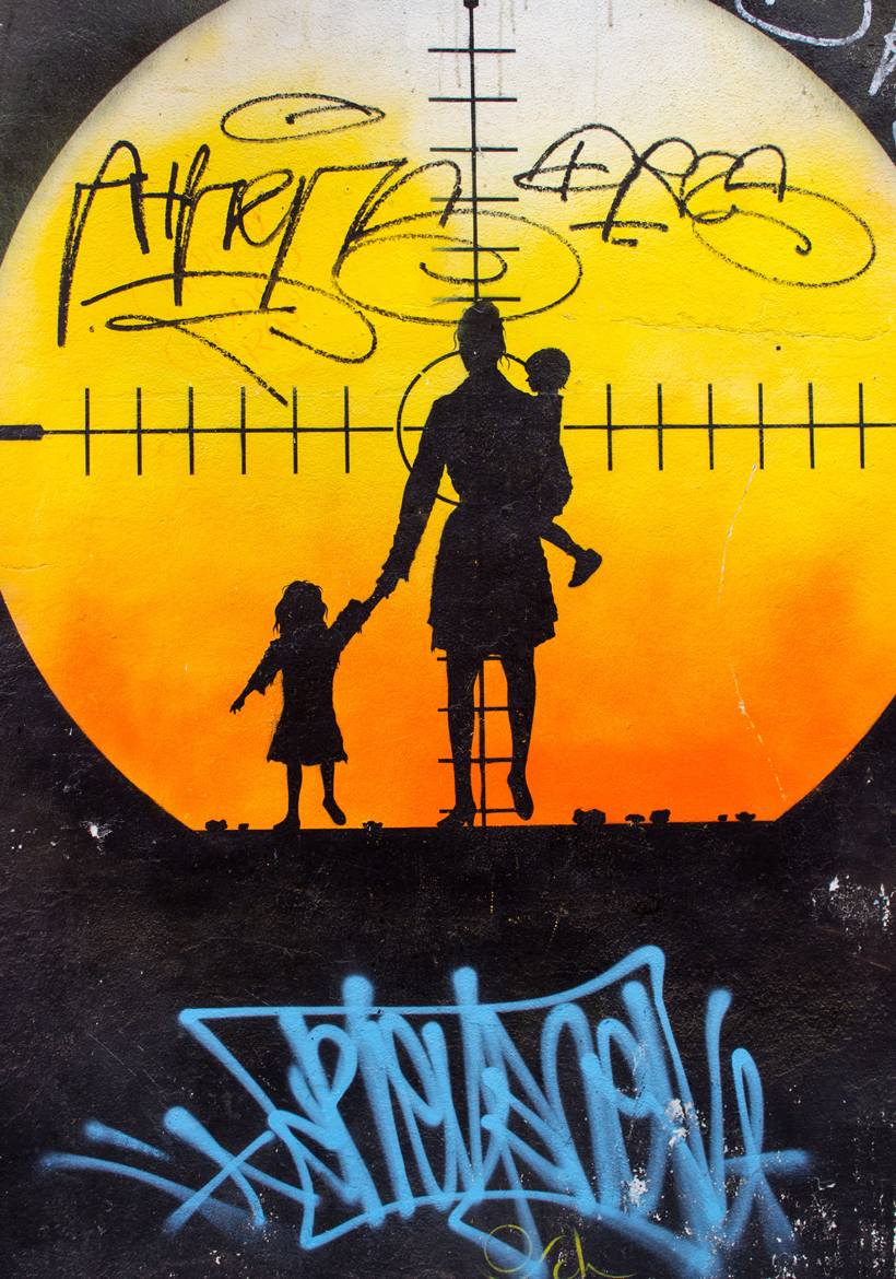 mother and kids wall art front of sunrise