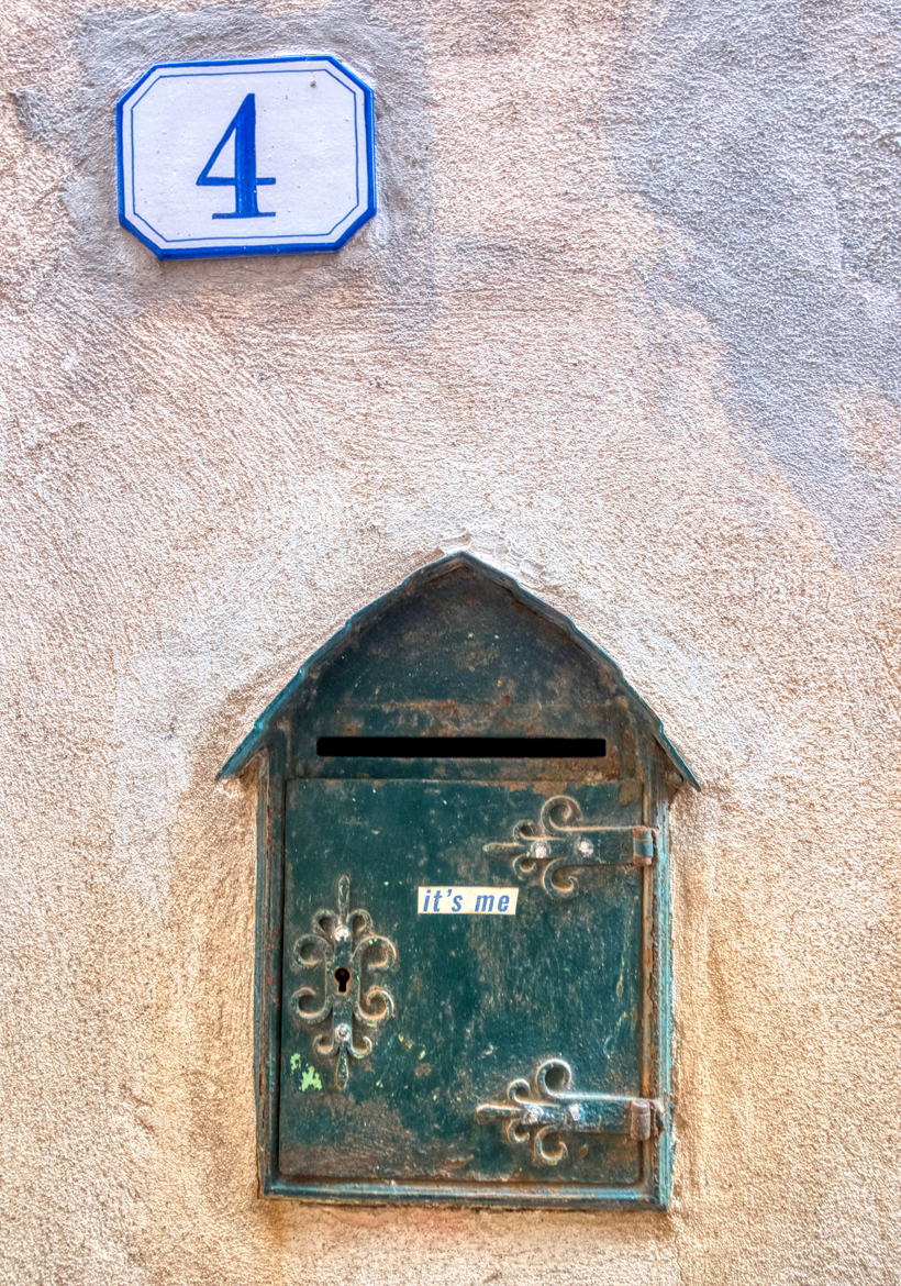 old green mailbox with engrave design