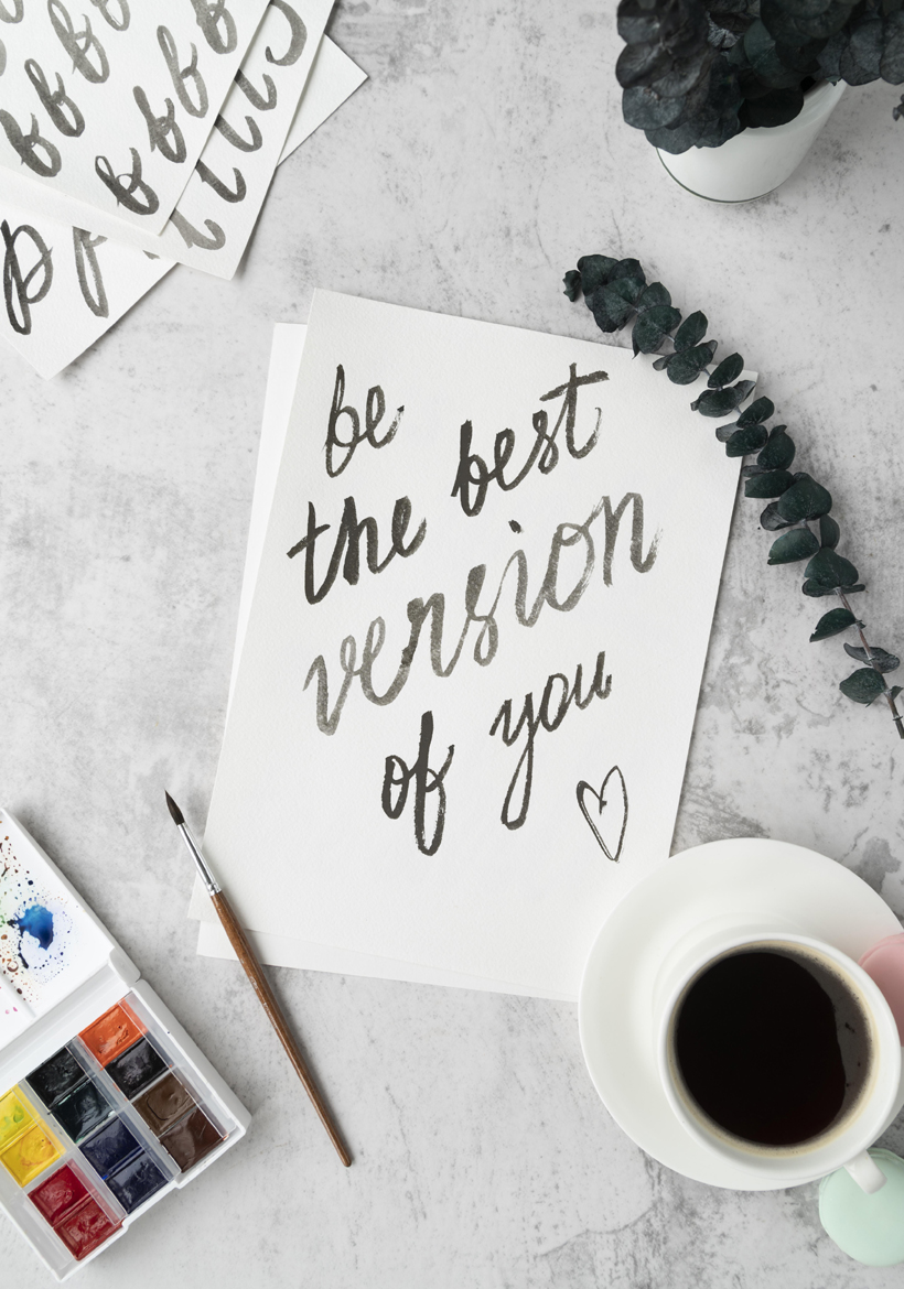 positive quotation near coffee mug with color pallete