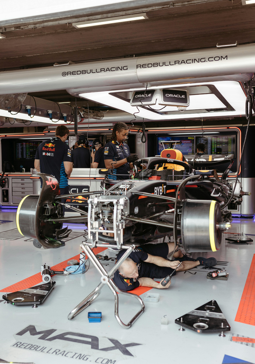 workers assembled f1 car in assembly area